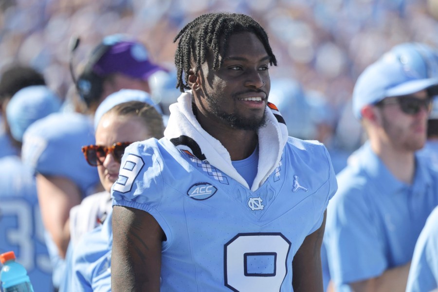 UNC wide receiver Devontez Walker (9) watches the game from the bench during the second quarter of an NCAA college football game against Minnesota, Saturday, Sept. 16, 2023, in Chapel Hill, N.C. (AP Photo/Reinhold Matay)