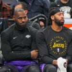 Los Angeles Lakers forward LeBron James (23) and center Anthony Davis (3) on the bench