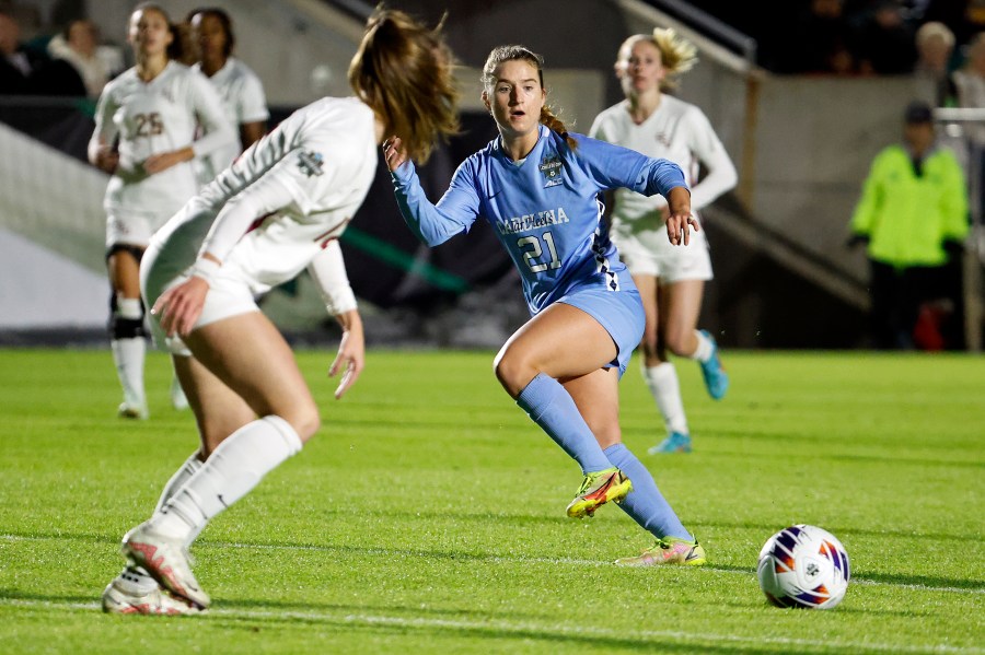 FILE - North Carolina's Ally Sentnor (21) passes the ball during the first half of the team's NCAA College Cup semifinal soccer match against Florida State in Cary, N.C., Dec. 2, 2022. Two players from North Carolina, Sentnor and Savy King, were selected with the top two picks in the National Women's Soccer League draft Friday night, Jan. 12, 2024. Sentnor, the ACC Midfielder of the Year, went with the No. 1 pick overall to the expansion Utah Royals. As a sophomore last year she had 11 goals and seven assists. (AP Photo/Karl B DeBlaker)