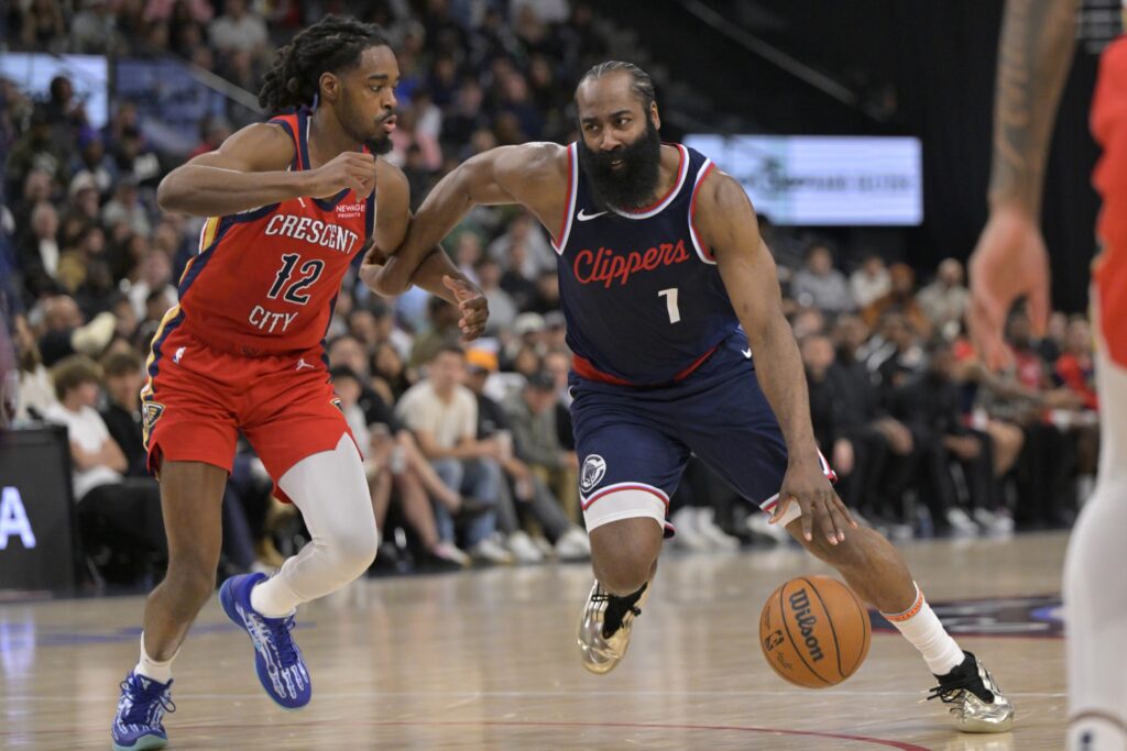 Apr 2, 2025; Inglewood, California, USA; Los Angeles Clippers guard James Harden (1) is defended by New Orleans Pelicans guard Antonio Reeves (12) in the second half at Intuit Dome. Mandatory Credit: Jayne Kamin-Oncea-Imagn Images