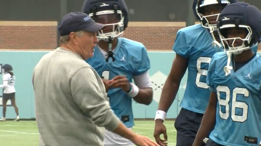 UNC head coach Bill Belichick with players during practice (Todd Gibson/CBS 17)