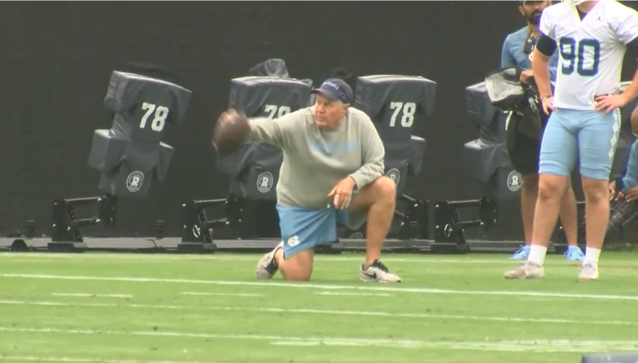 UNC head coach Bill Belichick with a football during practice (Todd Gibson/CBS 17)